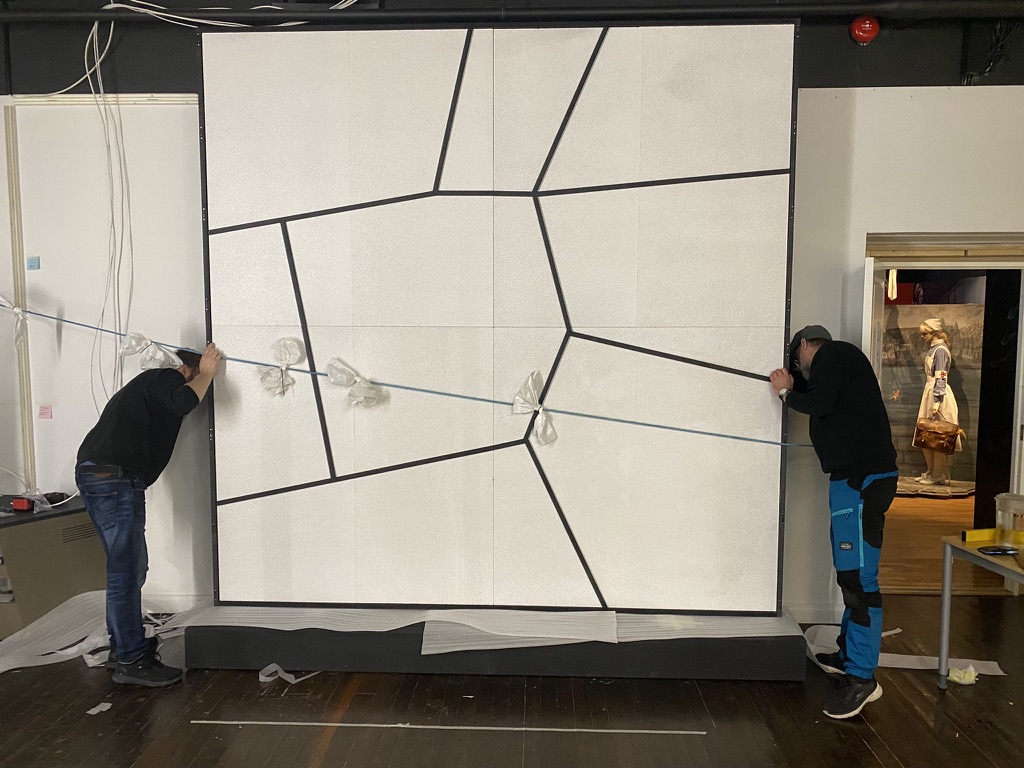 Mounting an exhibition panel on site